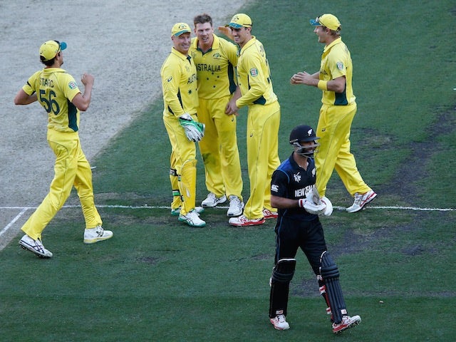 James Faulkner of Australia lets Grant Elliot of New Zealand know he took his wicket during the 2015 ICC Cricket World Cup final match between Australia and New Zealand at Melbourne Cricket Ground on March 29, 2015