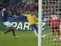 Brazil's forward Neymar strikes on his way to score a goal during the friendly football match France vs Brazil, on March 26, 2015