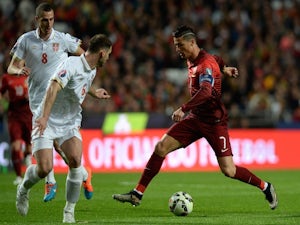 Portugal edge out Serbia to go top