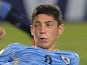 Federico Valverde (R) of Uruguay in action against Ecuador in the U-17 South American final round football match at Feliciano Caceres Stadiun in Luque, Paraguay on March 17, 2015