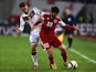 Georgia's Giorgi Navalovski (R) and Germany's midfielder Mesut Ozil vie for the ball during the Euro 2016 qualifying football match between Georgia and Germany at the Boris-Paitschadse-Stadium in Tbilisi , Georgia on March 29, 2015