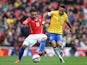 Gonzalo Jara of Chile and Neymar of Brazil comnpete for the ball during the international friendly match between Brazil and Chile at the Emirates Stadium on March 29, 2015