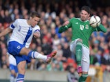 Kyle Lafferty (R) of Northern Ireland and Niklas Moisander (L) of Finland in action during the EURO 2016 Group F qualifier at Windsor Park on March 29, 2015