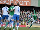 Kyle Lafferty of Northern Ireland scores during the EURO 2016 Group F qualifier at Windsor Park on March 29, 2015