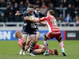 Mark Cueto of Sale Sharks is tackled by Brendan Macken of Gloucester during the Aviva Premiership rugby match between Sale Sharks and Gloucester Rugby at AJ Bell Stadium on March 29, 2015