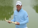 Richie Ramsay of Scotland poses with the trophy after winning the Trophee Hassan II Golf at Golf du Palais Royal on March 29, 2015