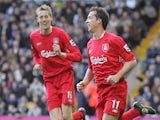 Liverpool's Robbie Fowler (R) celebrates scoring the first goal against West Bromwich Albion with teammate Peter Crouch during their English Premiership soccer match at The Hawthorns, West Bromwich, England, 04 March 2006