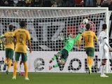 Germany's goalkeeper Ron-Robert Zieler fails to save the ball during the friendly football match Germany vs Australia in Kaiserslautern, southern Germany on March 25, 2015