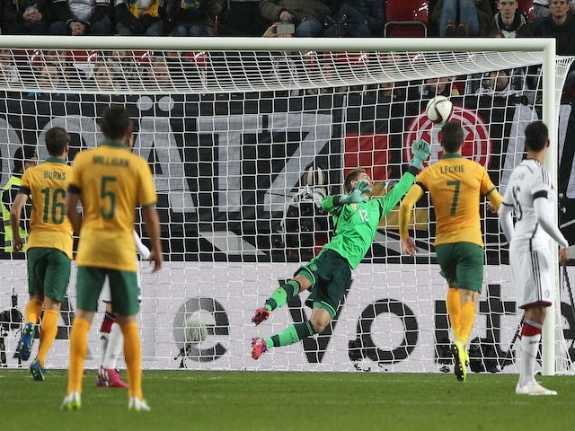 Germany's goalkeeper Ron-Robert Zieler fails to save the ball during the friendly football match Germany vs Australia in Kaiserslautern, southern Germany on March 25, 2015