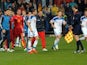 Players leave the pitch as the referee suspends the Euro 2016 group G qualifying football match between Montenegro and Russia at the City stadium in Podgorica on March 27, 2015