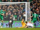 Shane Long of Republic of Ireland scores their first goal past Lukasz Fabianski of Poland during the EURO 2016 Qualifier match between Republic of Ireland and Poland at Aviva Stadium on March 29, 2015