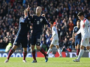 Scotland's striker Steven Naismith (2nd L) celebrates after scoring their fourth goal during the Euro 2016 qualifying football match between Scotland and Gibraltar at Hampden Park in Glasgow, Scotland on March 29, 2015