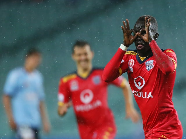 Awer Mabil #17 of Adelaide United celebrates his goal with team-mates during the round 24 A-League match between Sydney FC and Adelaide United at Allianz Stadium on April 4, 2015