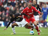 Afonso Alves of Middlesbrough is challenged by Patrice Evra of Manchester United during the Barclays Premier League match between Middlesbrough and Manchester United at the Riverside Stadium on April 6, 2008