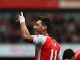 Arsenal's German midfielder Mesut Ozil celebrates after scoring their second goal during the English Premier League football match between Arsenal and Liverpool at the Emirates Stadium in London on April 4, 2015