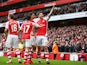 Olivier Giroud of Arsenal celebrates with team mates after scoring his team's fourth goal during the Barclays Premier League match between Arsenal and Liverpool at Emirates Stadium on April 4, 2015