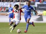 Augsburg's Brazil midfielder Caiuby and Schalke's Cameroon striker Eric Maxim Choupo-Moting vie for the ball during the German first division Bundesliga football match FC Augsburg vs FC Schalke 04 in Augsburg, southern Germany, on April 5, 2015