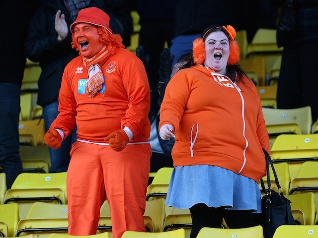 Blackpool fans celebrate the team's second goal during the Sky Bet Championship match against Watford at Vicarage Road on January 24, 2015