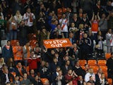Supporters of Blackpool protest against chairman Karl Oyston at the beginning of the second half during the Sky Bet Championship match between against Cardiff City at Bloomfield Road on October 3, 2014