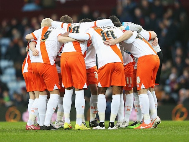 Blackpool players huddle during the FA Cup Third Round match against Aston Villa at Villa Park on January 4, 2015