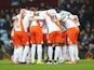 Blackpool players huddle during the FA Cup Third Round match against Aston Villa at Villa Park on January 4, 2015
