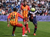 Bordeaux's Senegalese forward Henri Saivet vies with Lens' French defender Ludovic Baal during the French L1 football match between Girondins de Bordeaux (FCGB) and Lens (RCL) on April 5, 2015