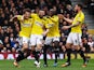 Stuart Dallas of Brentford celebates with team mates after opening the scoring during the Sky Bet Championship match between Fulham and Brentford at Craven Cottage on April 3, 2015