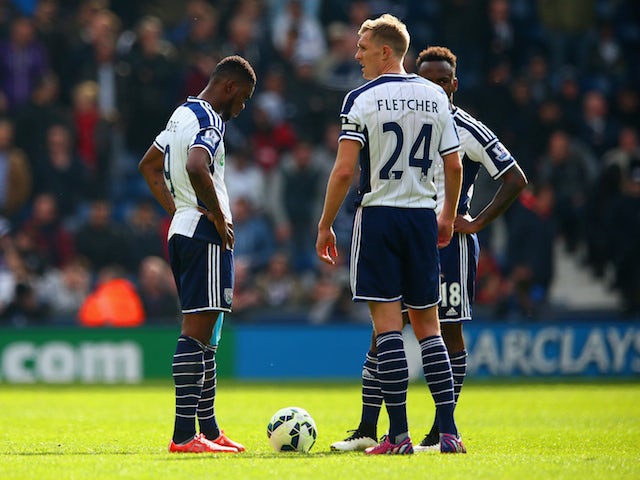 Dejected Brown Ideye, Darren Fletcher and Saido Berahino of West Brom after conceding the third goal during the Barclays Premier league match West Bromwich Albion and Queens Park Rangers at The Hawthorns on April 4, 2015