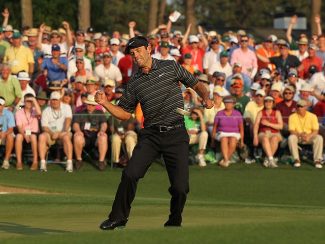 Charl Schwartzel of South Africa celebrates his two-stroke victory on the 18th green during the final round of the 2011 Masters Tournament at Augusta National Golf Club on April 10, 2011
