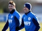 Charlie Austin (L) and Joey Barton in action during a Queens Park Rangers training session at the Harlington Sports Ground on February 6, 2015