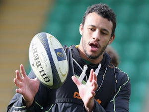 Courtney Lawes passes the ball during the Northampton Saints training session held on April 1, 2015 