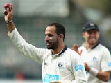 Fawad Ahmed of Victoria walks off holding the ball up high after taking eight wickets during day two of the Sheffield Shield final match between Victoria and Western Australia at Blundstone Arena on March 22, 2015