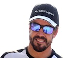 Fernando Alonso of Spain and McLaren Honda smiles as he walks through the paddock after practice for the Malaysia Formula One Grand Prix at Sepang Circuit on March 27, 2015