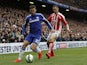 Stoke City's US defender Geoff Cameron (R) challenges Chelsea's Belgian midfielder Eden Hazard (L) during the English Premier League football match between Chelsea and Stoke City at Stamford Bridge in London on April 4, 2015