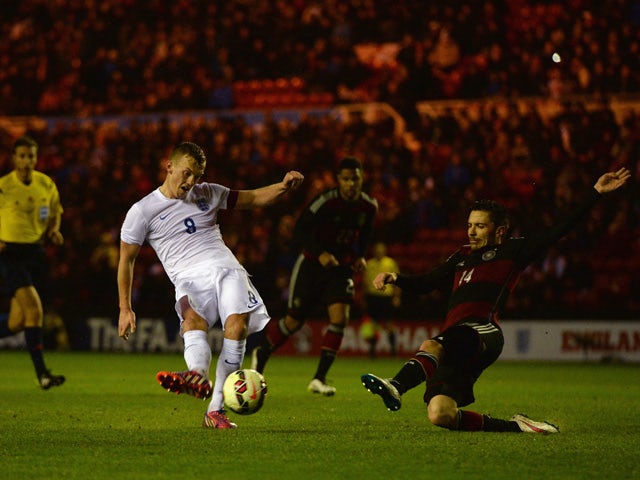 James Ward-Prowse of England scores their third goal under pressure from Julian Korb of Germany during the international friendly between England Under 21 and Germany Under 21 at Riverside Stadium on March 30, 2015