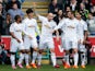 Ki Sung-Yueng of Swansea City celebrates scoring the opening goal with team mates during the Barclays Premier League match between Swansea City and Hull City at Liberty Stadium on April 4, 2015