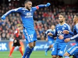 Lyon's French forward Alexandre Lacazette jubilates after scoring during the French L1 football match between Guingamp and Lyon on April 4, 2015