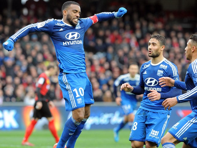 Lyon's French forward Alexandre Lacazette jubilates after scoring during the French L1 football match between Guingamp and Lyon on April 4, 2015