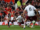 Manchester United's Spanish midfielder Ander Herrera scores the opening goal during the English Premier League football match between Manchester United and Aston Villa at Old Trafford in Manchester, North West England on April 4, 2015