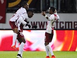 Metz' Malian forward Modibo Maiga celebrates with teammates after scoring during the French L1 football match between Metz (FCM) and Toulouse (TFC) on April 4, 2015