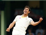 Mitchel Starc of Australia celebrates after taking the wicket of Suresh Raina of India during day five of the Fourth Test match between Australia and India at Sydney Cricket Ground on January 10, 2015