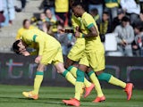 Nantes' US midfielder Alejandro Bedoya celebrates with teammates after scoring a goal during the French L1 football match between Nantes and Caen on April 5, 2015