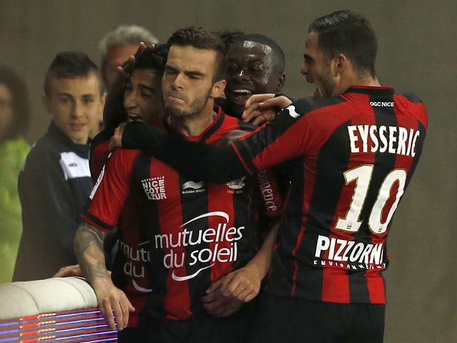 Nice's French forward Alexy Bosetti celebrates with teammates after scoring a goal during the French L1 football match between Nice and Evian Thonon on April 4, 2015 