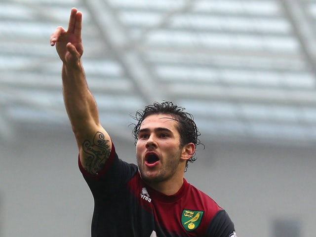 Bradley Johnson of Norwich celebrates scoring the opening goal during the Sky Bet Championship match between Brighton & Hove Albion and Norwich City at Amex Stadium on April 3, 2015
