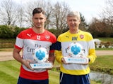 Proud pair Olivier Giroud and Arsene Wenger pose with their awards