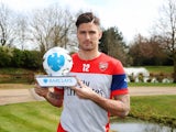 Olivier Giroud poses with his Player of the Month award for March 2015