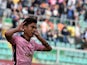 Paulo Dybala of Palermo celebrates after scoring a penalty (1-1) during the Serie A match between US Citta di Palermo and AC Milan at Stadio Renzo Barbera on April 4, 2015
