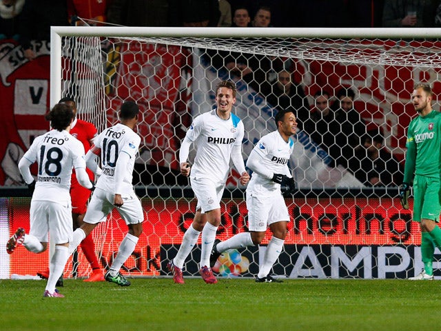 Luuk de Jong of PSV celebrates with team mates after he scores the first goal of the game during the Dutch Eredivisie match between FC Twente and PSV Eindhoven held at De Grolsch Veste Stadium on April 4, 2015
