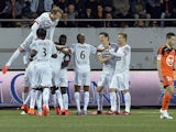 Rennes' players celebrate after scoring during the French L1 football match between FC Lorient and Stade Rennais FC on April 4, 2015