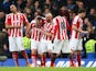 Charlie Adam of Stoke City celebrates with team-mates after scoring his team's first goal during the Barclays Premier League match between Chelsea and Stoke City at Stamford Bridge on April 4, 2015